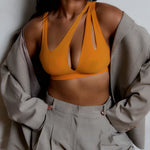 person wearing a tangerine tee system on a plain background