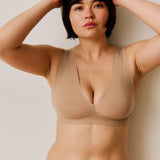 A person wearing a beige vii system against a plain background.