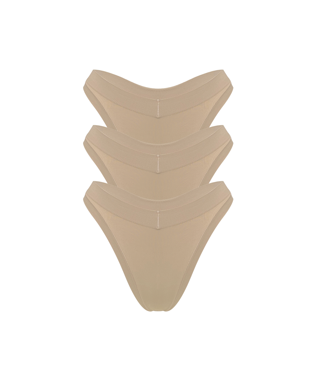 Three stacked nude beige thong underwear stacked on a solid white background.