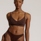 woman in mocha cami system on a plain background
