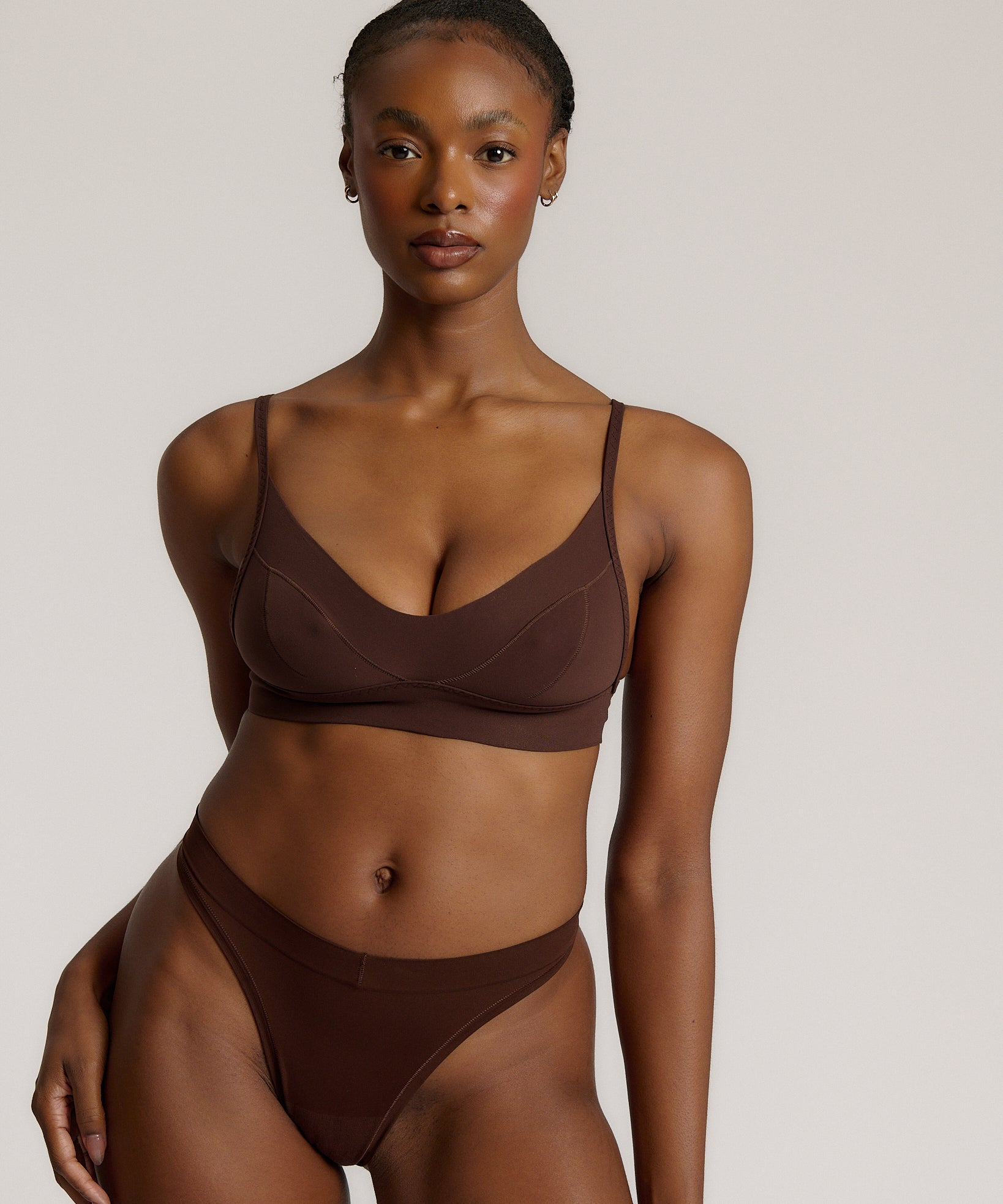 woman in mocha cami system on a plain background