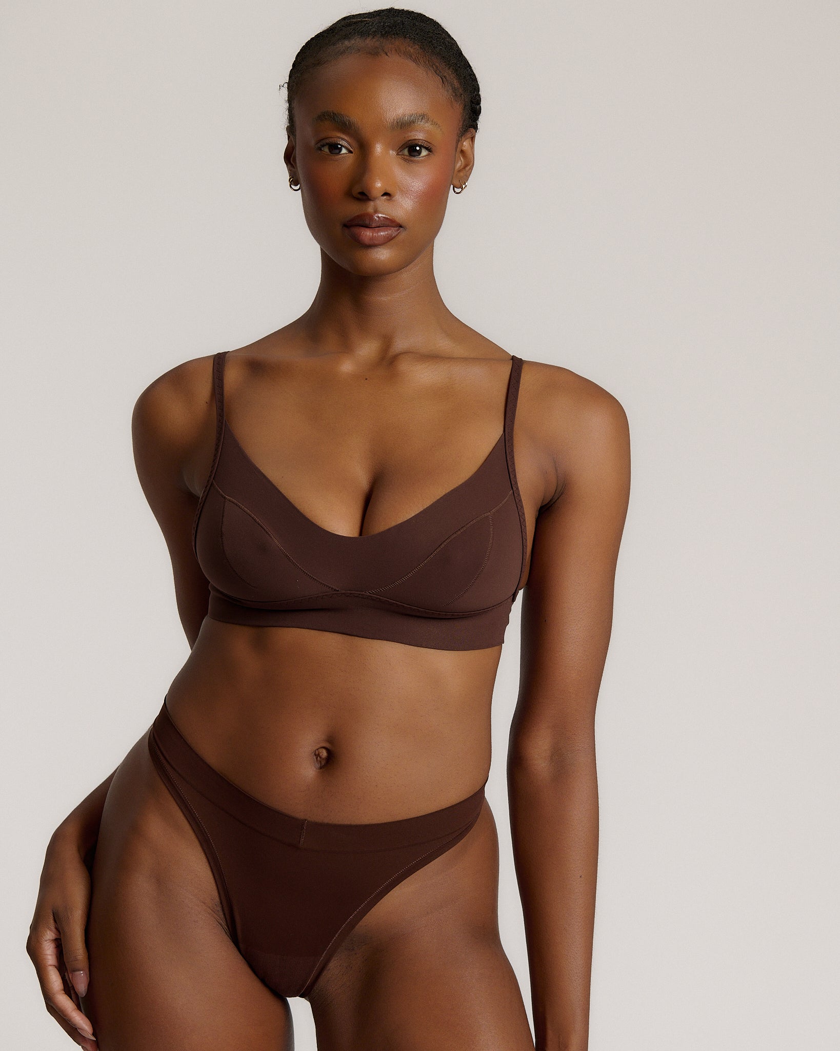 woman in mocha cami system on a plain background