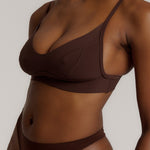 woman in mocha cami system on a plain background