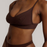 woman in mocha cami system on a plain background