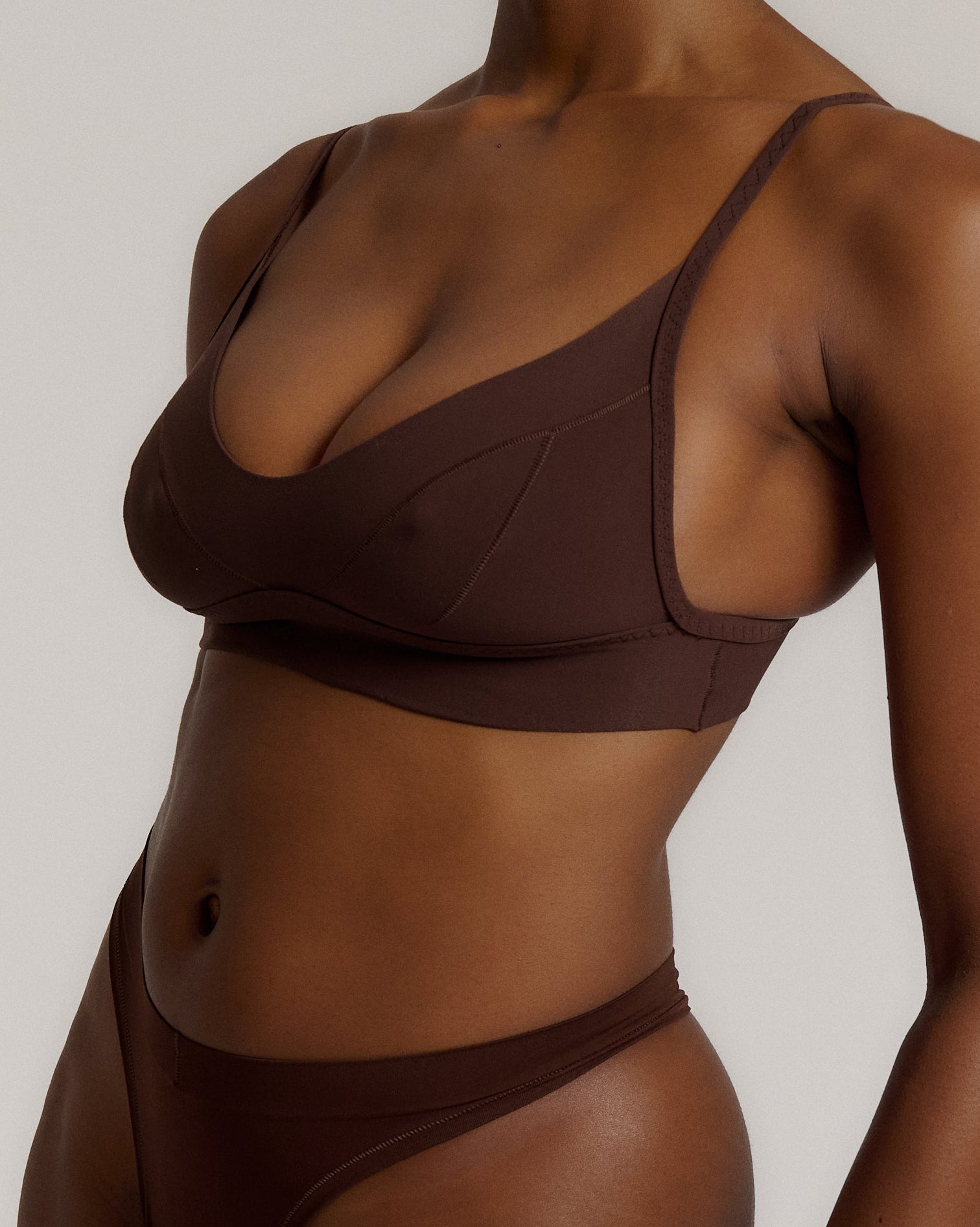 woman in mocha cami system on a plain background