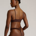 woman in mocha cami system on a plain background
