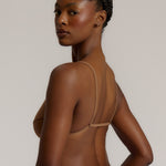 A woman wearing a brownz scoop system and matching bottoms