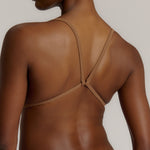 A woman wearing a brownz scoop system and matching bottoms