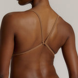 A woman wearing a brownz scoop system and matching bottoms