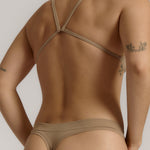 A woman wearing a light scoop system and matching bottoms
