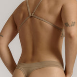 A woman wearing a light scoop system and matching bottoms