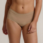 A pair of beige, mid-rise women's underwear.