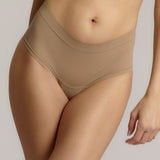 A pair of beige, mid-rise women's underwear.