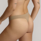 Woman standing wearing the Thong in light
