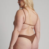 A woman wearing a brown scoop system and matching bottoms
