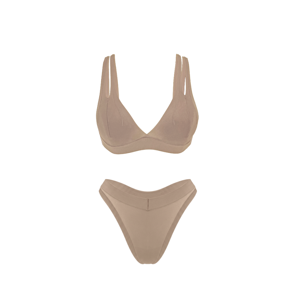 A two-piece underwear set in a solid beige color, featuring a V-neck triangle top with wide shoulder straps and matching thong bottoms, displayed on a clean white background.