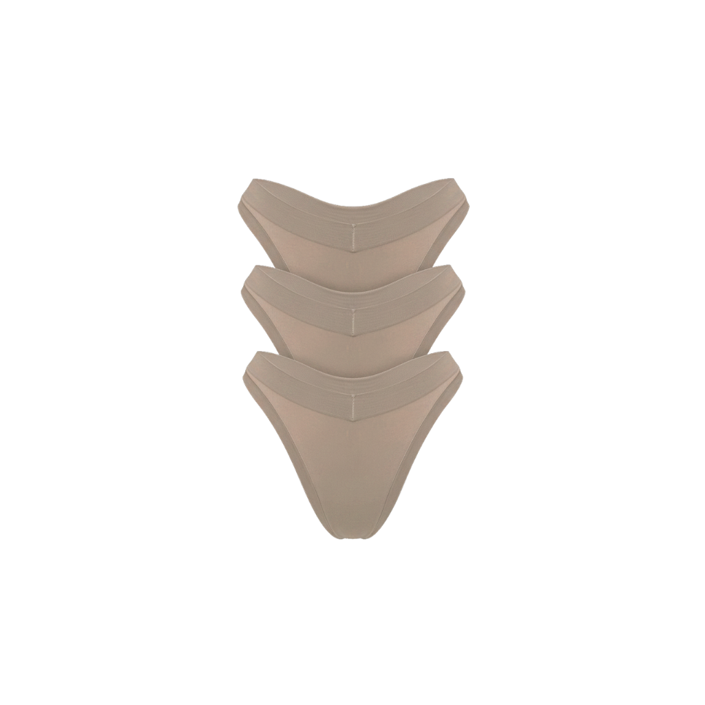 Three stacked, nude/beige underwear briefs on a solid white background.