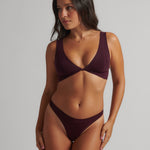 Woman wearing the Merlot Twist System