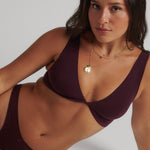 Woman wearing the Merlot Twist System