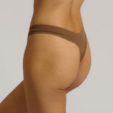 Woman standing wearing the Thong in brownz
