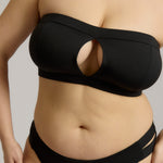 Black strapless bikini worn by a person on a neutral background