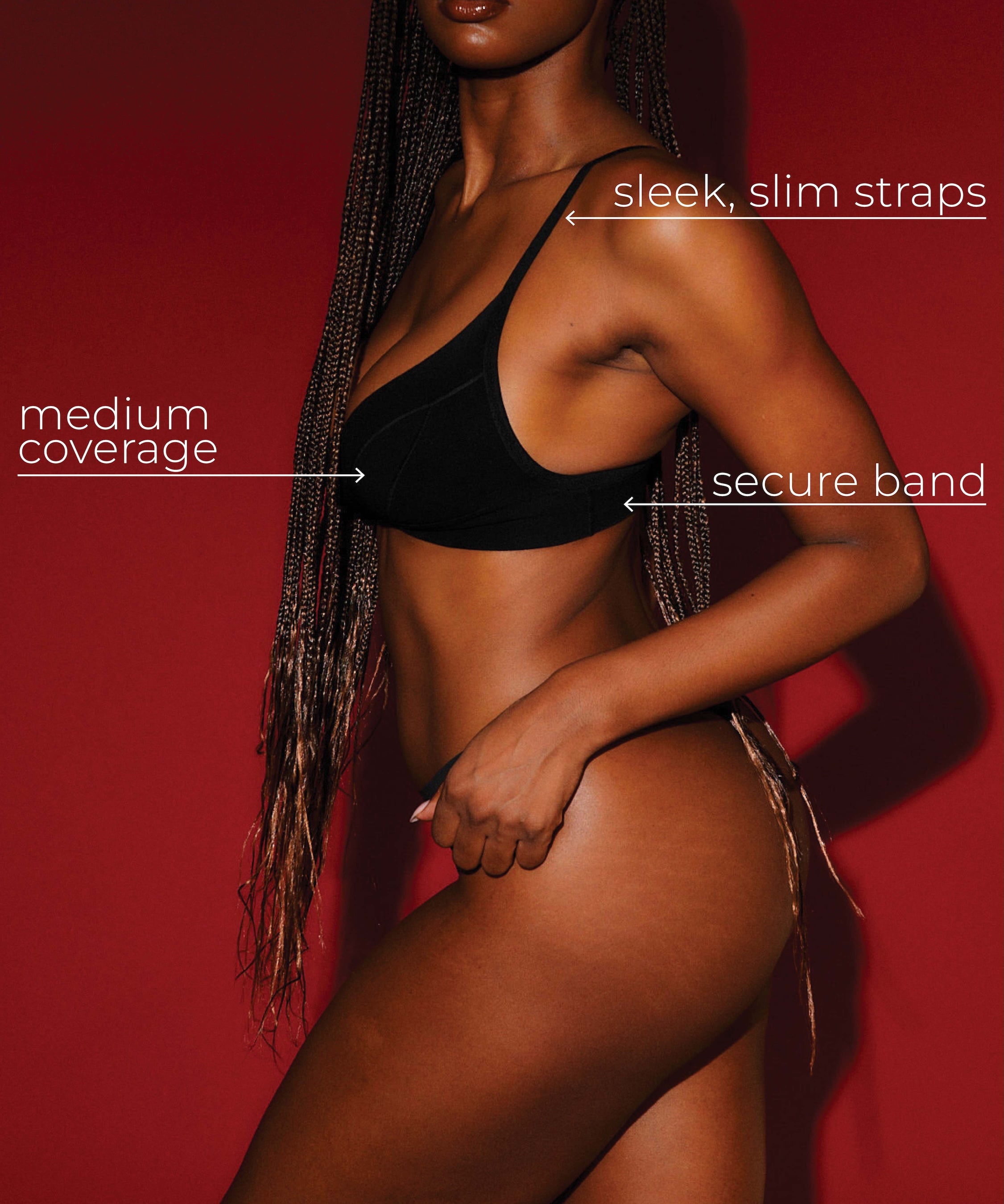 Model wearing a black cami system with text highlighting features on a red background